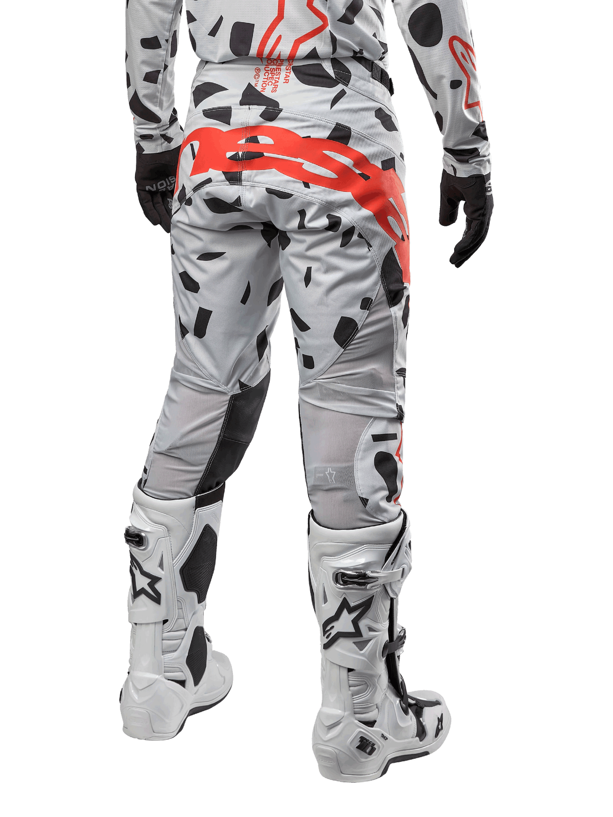 Alpinestars 2024 Techstar Rantera Pants, Motocross Pants, Haze Gray Camo, featuring black camo patterns and a large red Alpinestars logo on the seat, rear view worn with white boots and matching racing gear