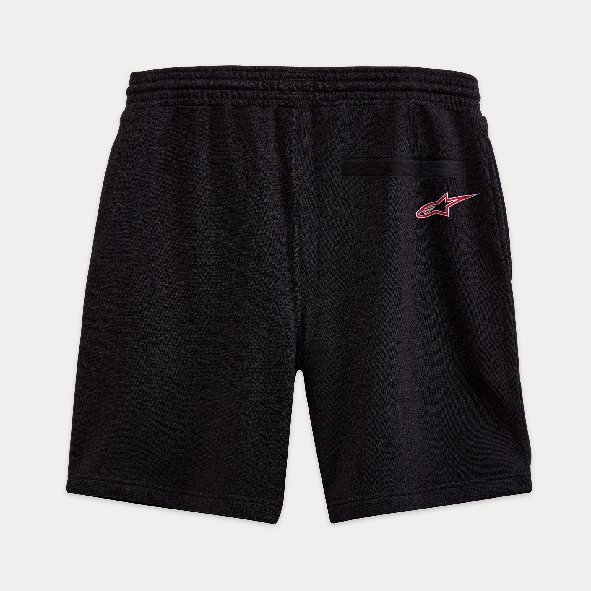 Alpinestars Dunker Short, short de entrenamiento de forro polar en color negro, vista posterior con cintura elástica, bolsillo trasero de ribete y logotipo Ageless rojo y blanco en la cadera.