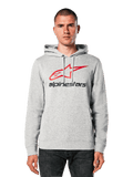 Alpinestars Always V3 Hoodie, gris claro jaspeado con logotipo de estrella en rojo y negro, lucida por un modelo, estilo urbano casual, capucha con cordones, bolsillo frontal tipo canguro, diseño con herencia del automovilismo
