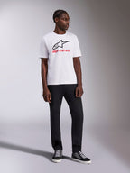 Alpinestars Always 2.0 CSF Tee, Short Sleeve T-Shirt, White, Black Astar Logo and Red Alpinestars Wordmark Graphic, worn by model with black pants and high-top sneakers, Casual Motorsport Sportswear