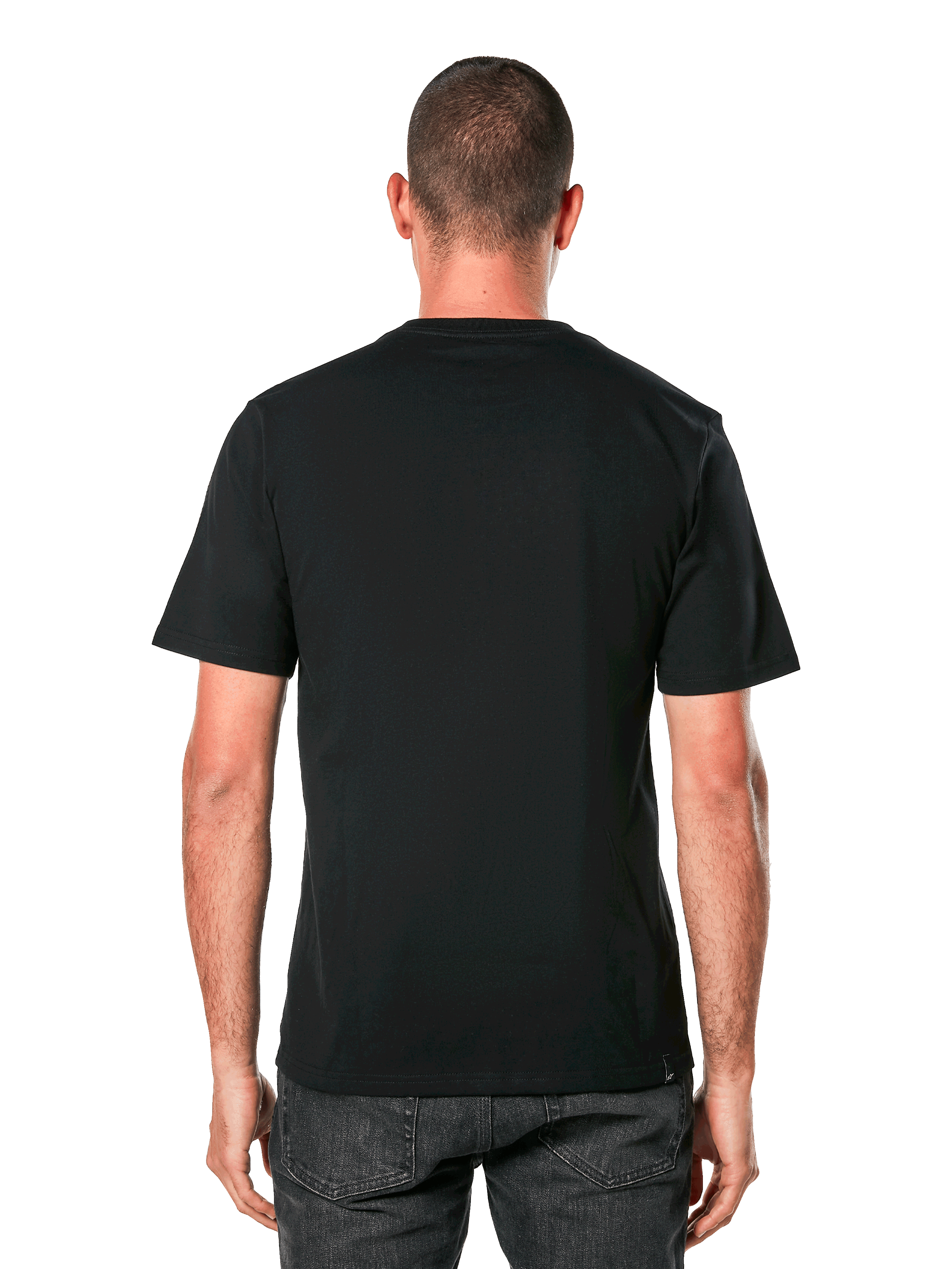 Camiseta Alpinestars Ride 4.0 CSF, vista posterior, camiseta negra de manga corta, ropa deportiva casual inspirada en el automovilismo, llevada por un hombre con vaqueros oscuros