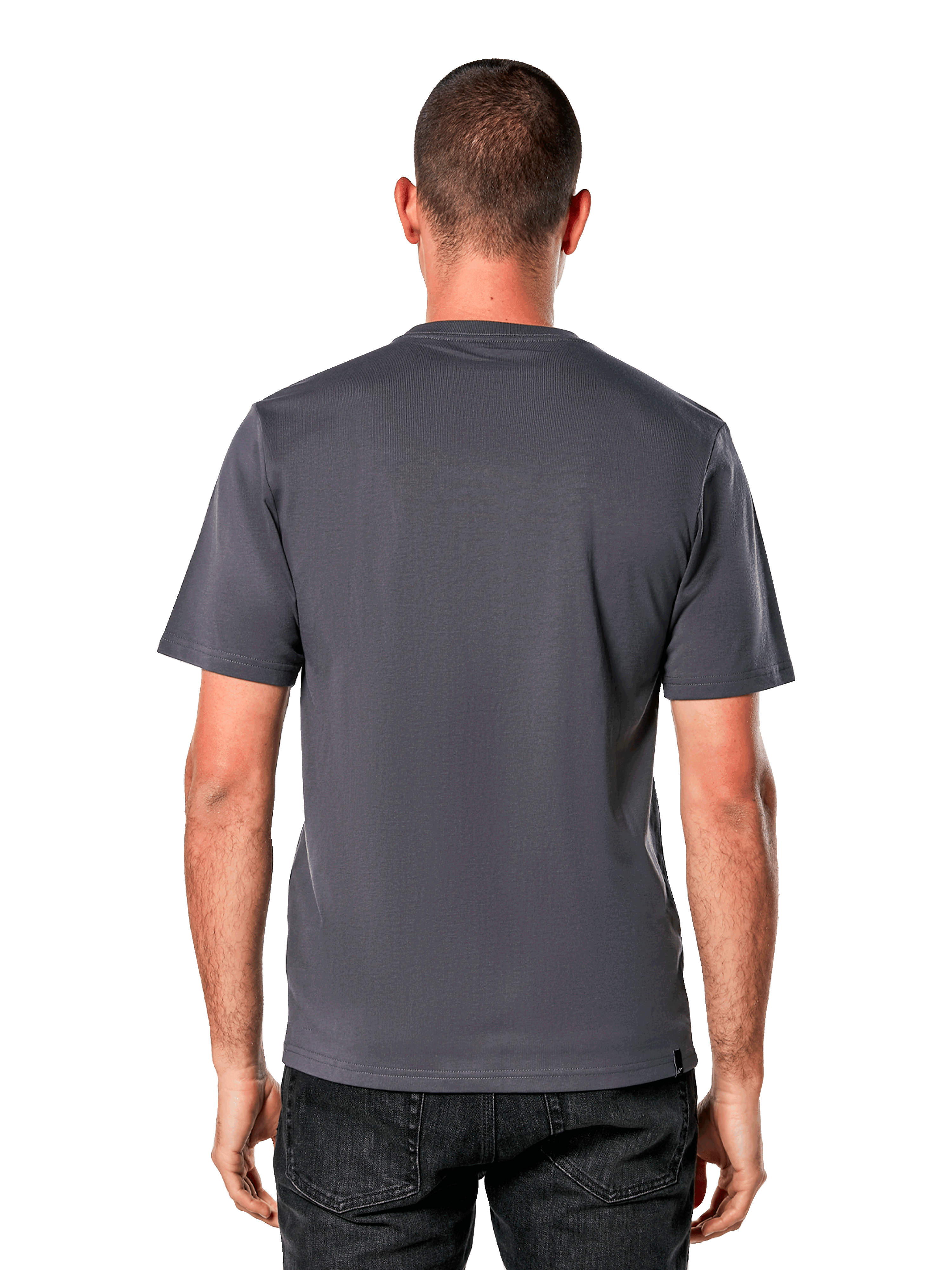 Camiseta Alpinestars Ride 4.0 CSF, vista posterior, camiseta de manga corta en color gris carbón, diseño de espalda lisa con corte y costura, combinada con vaqueros negros, ropa urbana casual inspirada en el automovilismo