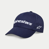 Gorra Alpinestars Linear Wordmark 2.0, azul marino con bordado blanco, visera curva y cierre a presión con logotipo lineal de Alpinestars en 3D y logo de estrella Ageless en el lateral, ropa deportiva casual