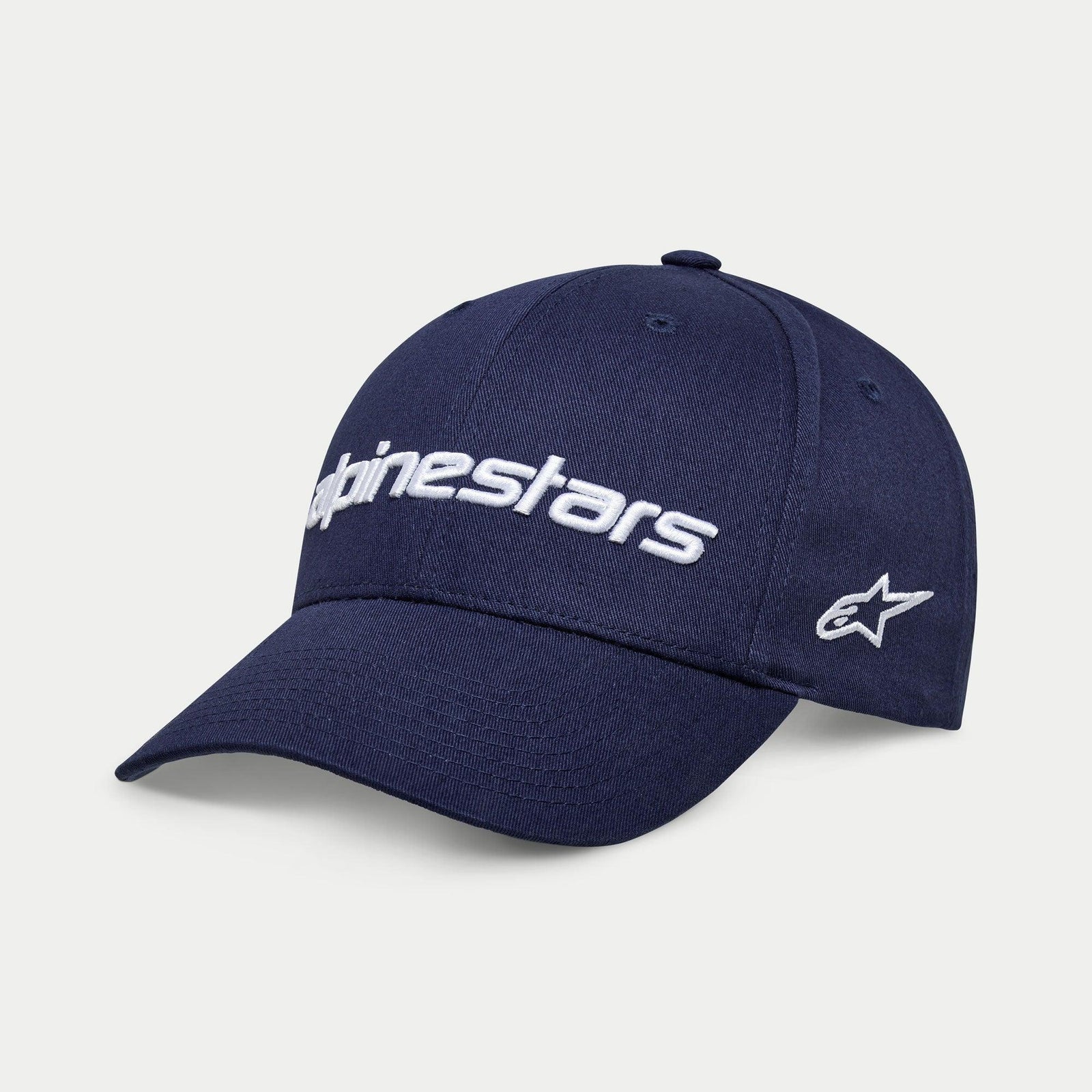 Gorra Alpinestars Linear Wordmark 2.0, azul marino con bordado blanco, visera curva y cierre a presión con logotipo lineal de Alpinestars en 3D y logo de estrella Ageless en el lateral, ropa deportiva casual