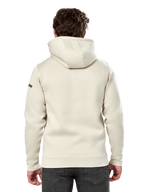 Sudadera Alpinestars Insignia Hoodie, vista trasera de un hombre con una sudadera de forro polar informal, color Off White, con capucha forrada y puños de canalé, ropa urbana inspirada en el automovilismo