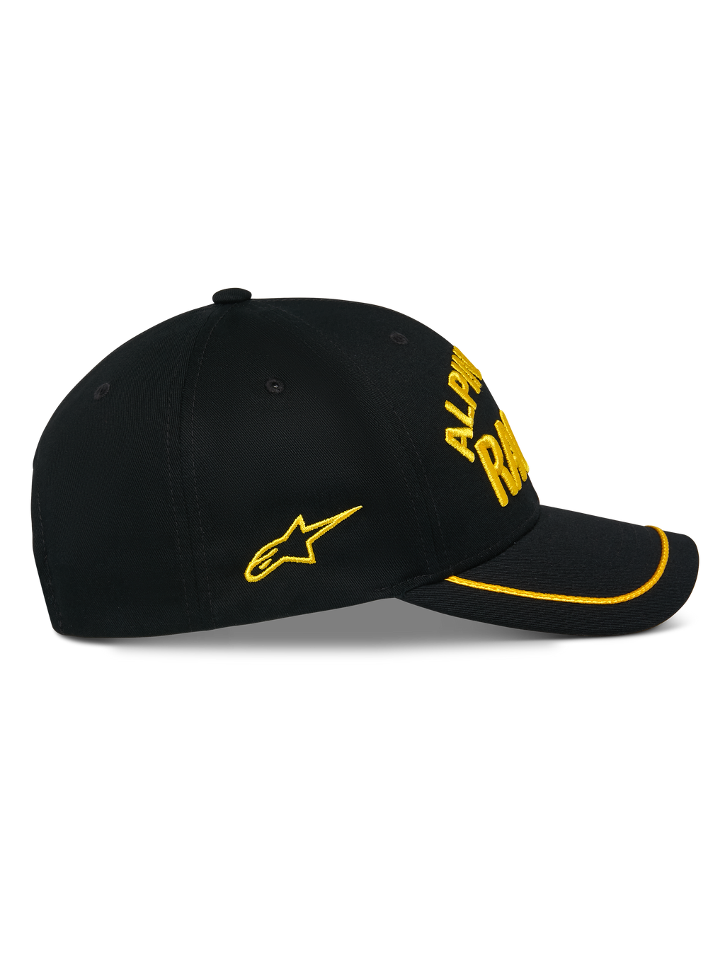 Gorra Luminary de Alpinestars, gorra snapback negra, vista lateral, visera curva con ribete de sutache amarillo, logotipo bordado en 3D y estrella lateral amarillos, 100% sarga de algodón, accesorio casual inspirado en el automovilismo