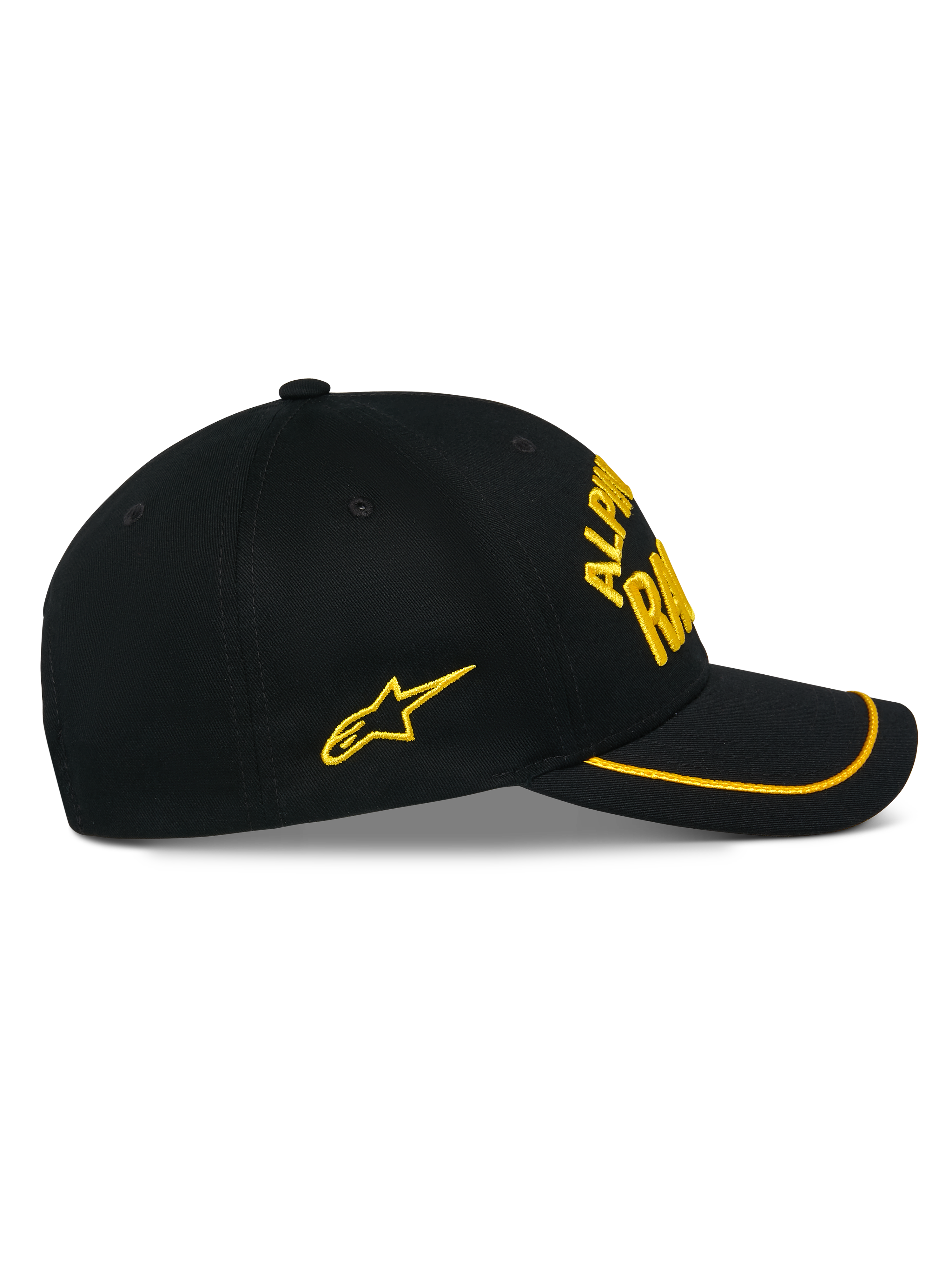 Gorra Luminary de Alpinestars, gorra snapback negra, vista lateral, visera curva con ribete de sutache amarillo, logotipo bordado en 3D y estrella lateral amarillos, 100% sarga de algodón, accesorio casual inspirado en el automovilismo