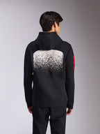 Sudadera con capucha Alpinestars Obsessed, vista trasera de sudadera de forro polar negra, con un gran gráfico de degradado MX moteado en blanco en la espalda y logotipos de Alpinestars en rojo en las mangas, ropa urbana casual inspirada en el automovilismo