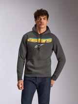 Sudadera con capucha Ellipsoid de Alpinestars, ropa deportiva casual, gris Gunmetal con logotipo Astars en degradado amarillo y azul y logotipo blanco, diseño de sudadera con capucha y cordón, combinada con vaqueros azul oscuro