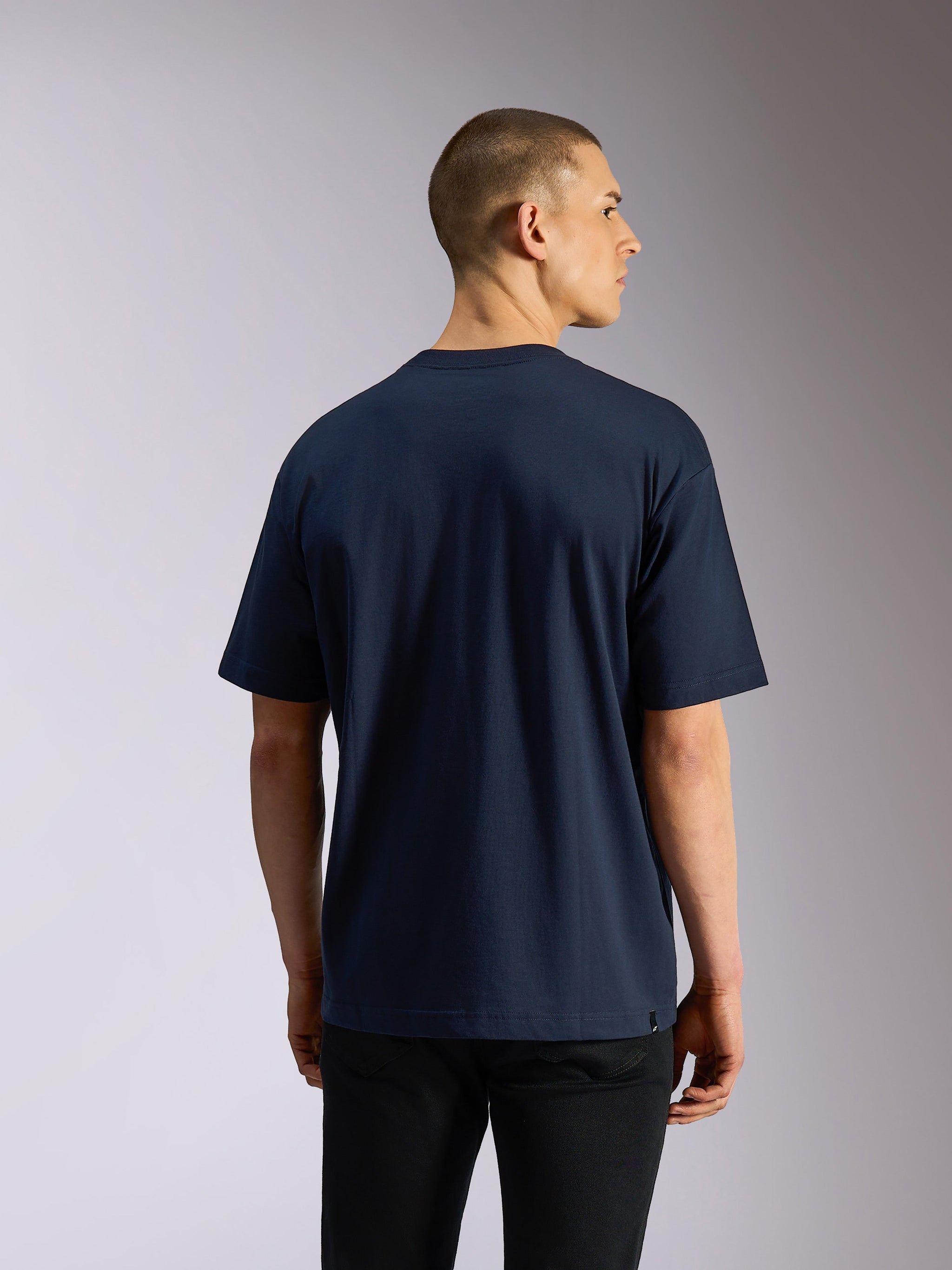 Alpinestars Aplomb Oversized CSF Tee, Short Sleeve T-Shirt, Navy, back view on model, relaxed oversized fit, casual motorsport-inspired streetwear