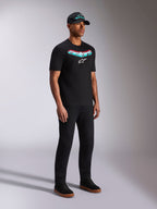 Alpinestars Ellipsoid CSF Tee, Black Short Sleeve T-Shirt, Teal and Red Gradient Astars Graphic with White Logo, Male model wearing casual streetwear with black cap and pants