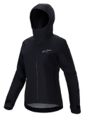 Alpinestars Stella A-Dura Elite Waterproof Jacket, chaqueta de MTB para mujer, negra, con diseño de capucha y solapa protectora, cremallera frontal, bolsillos con cremallera y puños ajustables con velcro, tejido técnico impermeable con logotipo plateado en el pecho