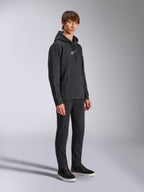 Alpinestars Frontal Hoodie, Black, pullover fleece hoodie with white HD logo on chest and wordmark logos on sleeves, kangaroo pocket, styled with black pants and sneakers, casual motorsport-inspired streetwear