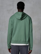 Alpinestars Essentials Ageless Zip Hoodie, back view on model, Cactus green, casual motorsport-inspired streetwear, relaxed fit with ribbed hem and cuffs, high-quality compact fleece