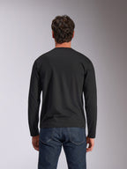 Alpinestars Trackside CSF Tee, Long Sleeve T-Shirt, Black, Back View, worn with dark blue denim jeans, casual motorsport-inspired streetwear