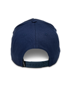 Alpinestars Ride Comp Snapback Hat, Navy Blue, rear view showing adjustable plastic snapback closure, small black logo tag, structured cotton twill crown, casual motorsport-inspired headwear