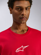 Alpinestars Frontal CSF Tee, Short Sleeve T-Shirt, Red, White Astars Logo on Chest, Close-up of model wearing sustainable performance wicking sportswear