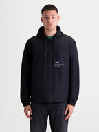Alpinestars Speeder Resolve, chaqueta cortavientos para hombre, negra, ligera con capucha ajustable y forro de malla, marca 'One Goal. One Vision.' en el pecho, estilo sportswear
