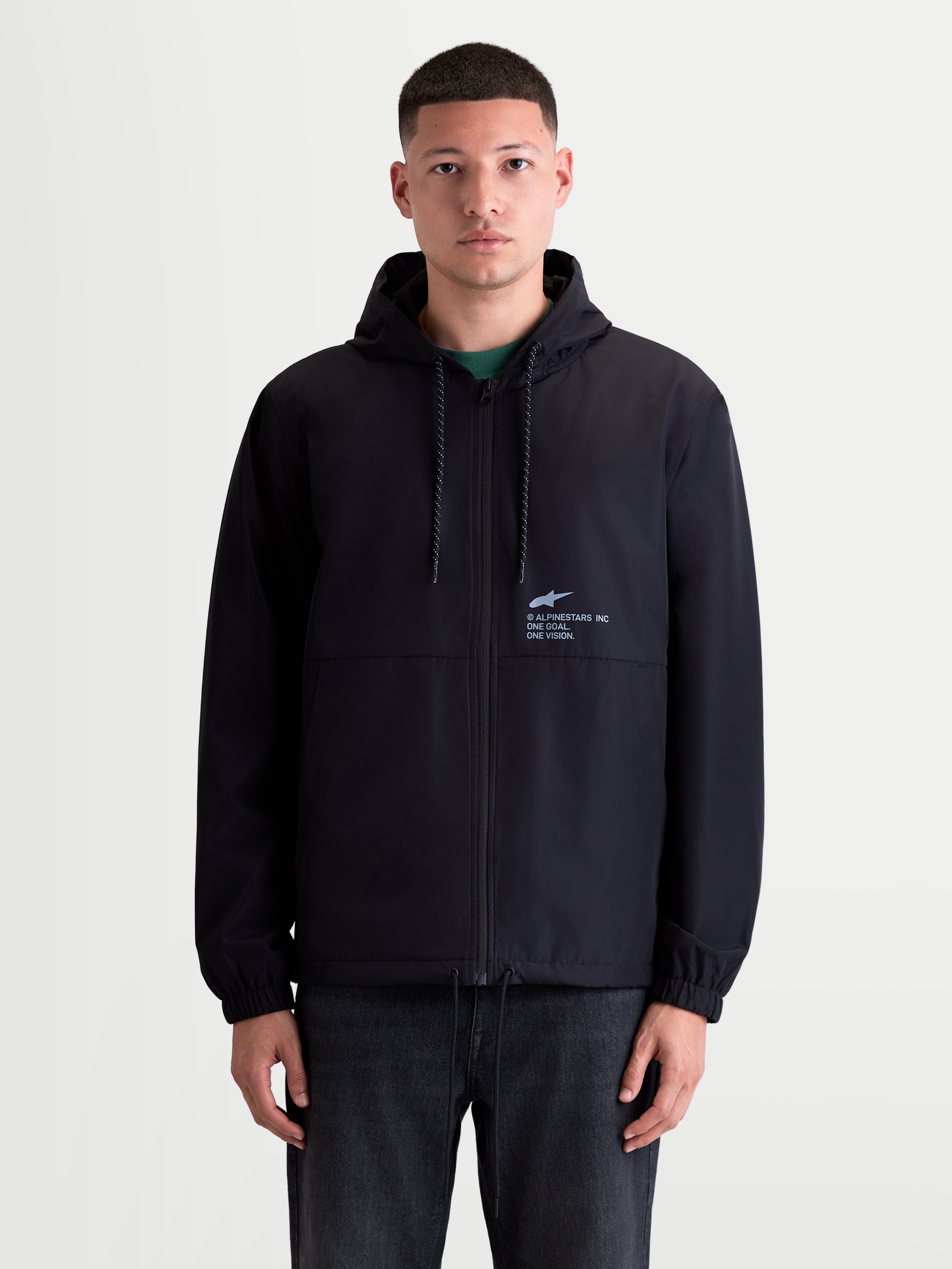 Alpinestars Speeder Resolve, chaqueta cortavientos para hombre, negra, ligera con capucha ajustable y forro de malla, marca 'One Goal. One Vision.' en el pecho, estilo sportswear