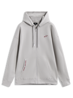Alpinestars Pioneer Oversized Hoodie, sudadera con cremallera gris cemento, detalles rojos y bolsillo canguro.