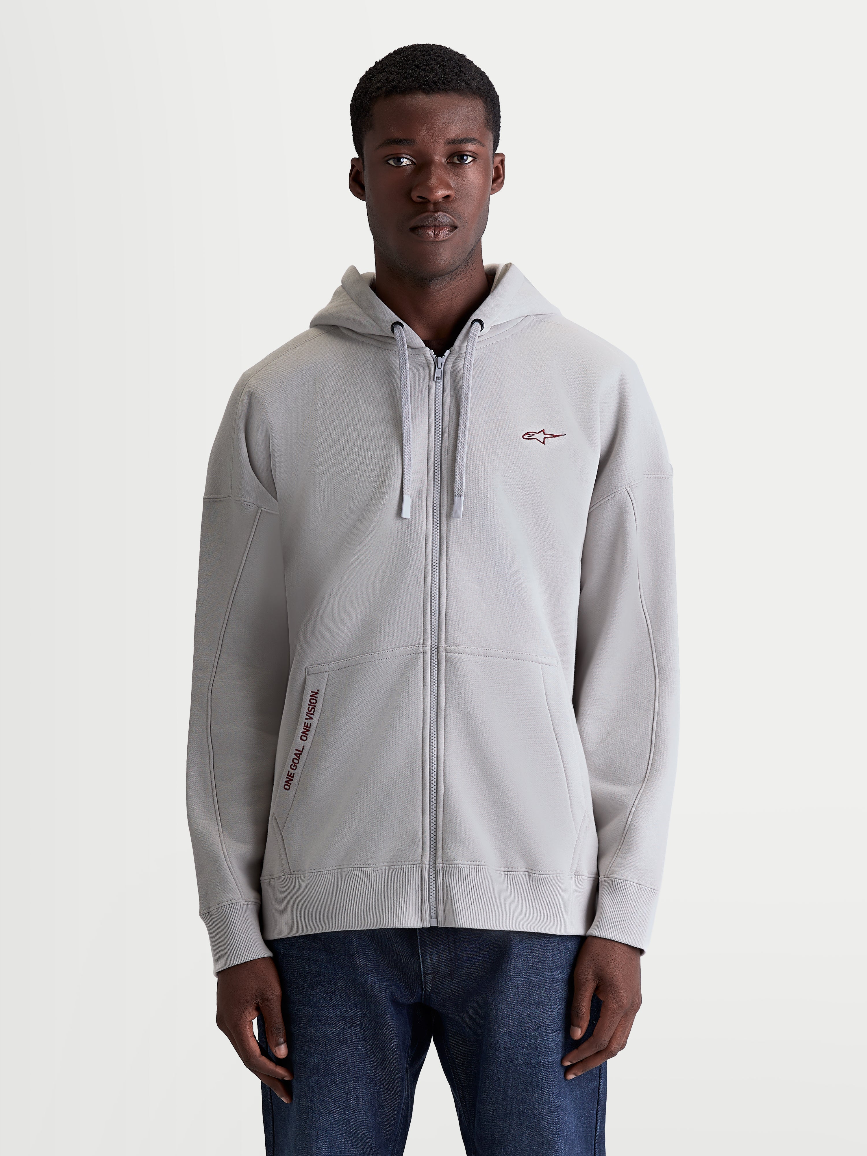 Alpinestars Sudadera con capucha Pioneer Oversized, sudadera de forro polar con cremallera completa para hombre, color gris cemento, ajuste oversized relajado, con bolsillo canguro y bordado One Goal One Vision, cremallera Vislon, estilo casual de sportswear.