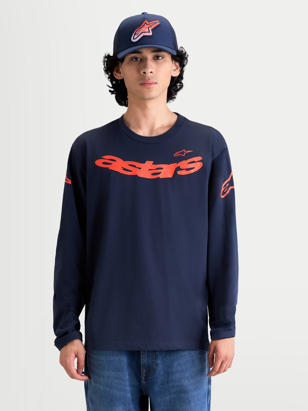 Alpinestars Camiseta Velocifier CSF, camiseta de mangas largas para hombre, azul marino y naranja, con gráfico frontal Astars curvo y logotipos en los hombros, puños de canalé, mezcla de algodón premium, ropa deportiva inspirada en el motorsport