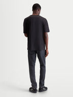 Alpinestars Infinity Oversized CSF Tee, Black Short Sleeve Sportswear T-Shirt, Back View on Model, Relaxed Fit for Everyday Comfort and Off-Bike Style.