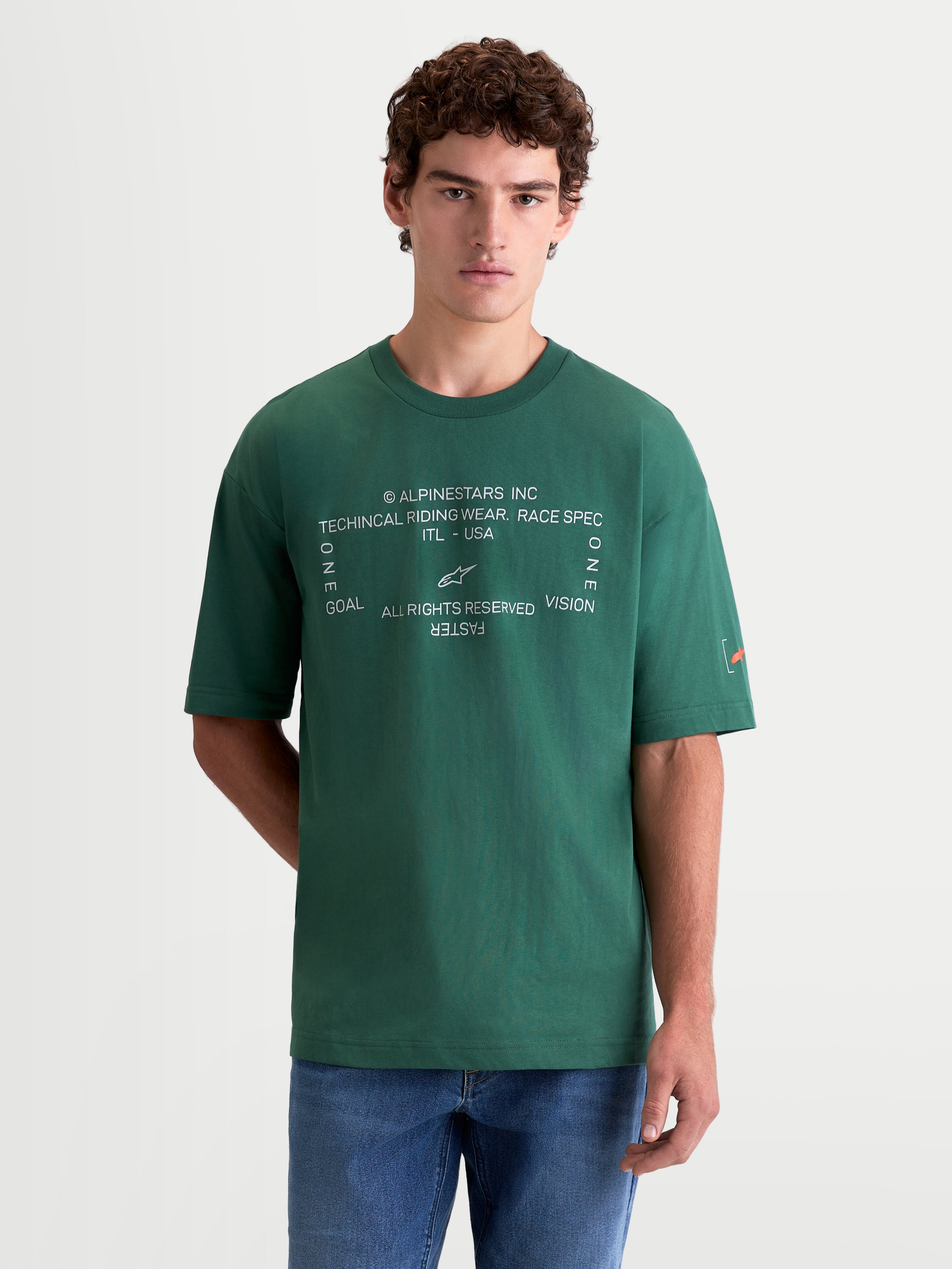 Alpinestars Infinity Oversized CSF Tee, Green Short Sleeve Sportswear T-Shirt, featuring a relaxed oversized fit and a white front graphic with 'One Goal One Vision' text and the Astars logo.