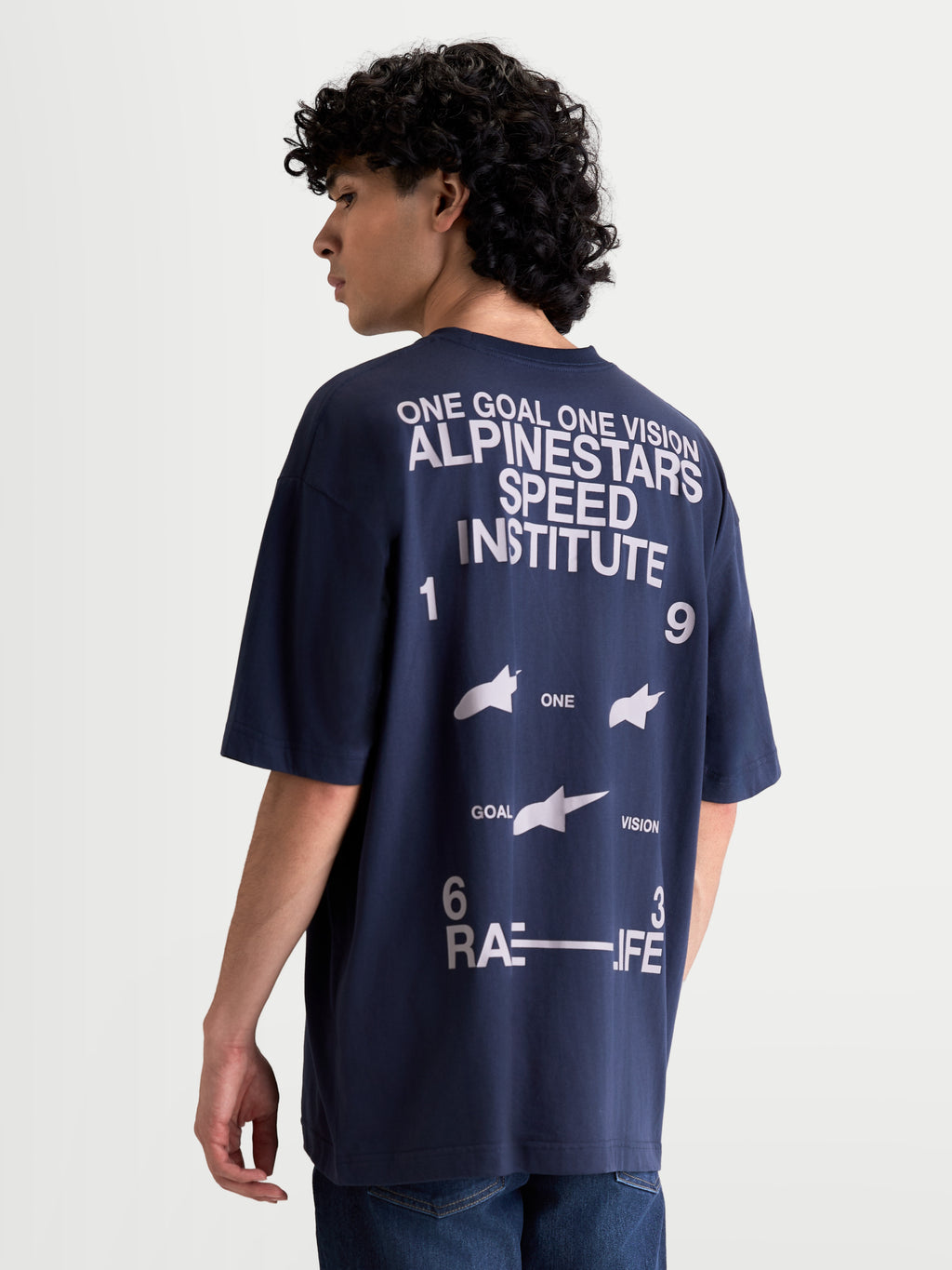Alpinestars Institute Oversized CSF Tee, Men's Sportswear Short Sleeve T-Shirt, Navy Blue and White, featuring large back graphics with Alpinestars Speed Institute and One Goal One Vision branding, relaxed oversized fit for everyday comfort.