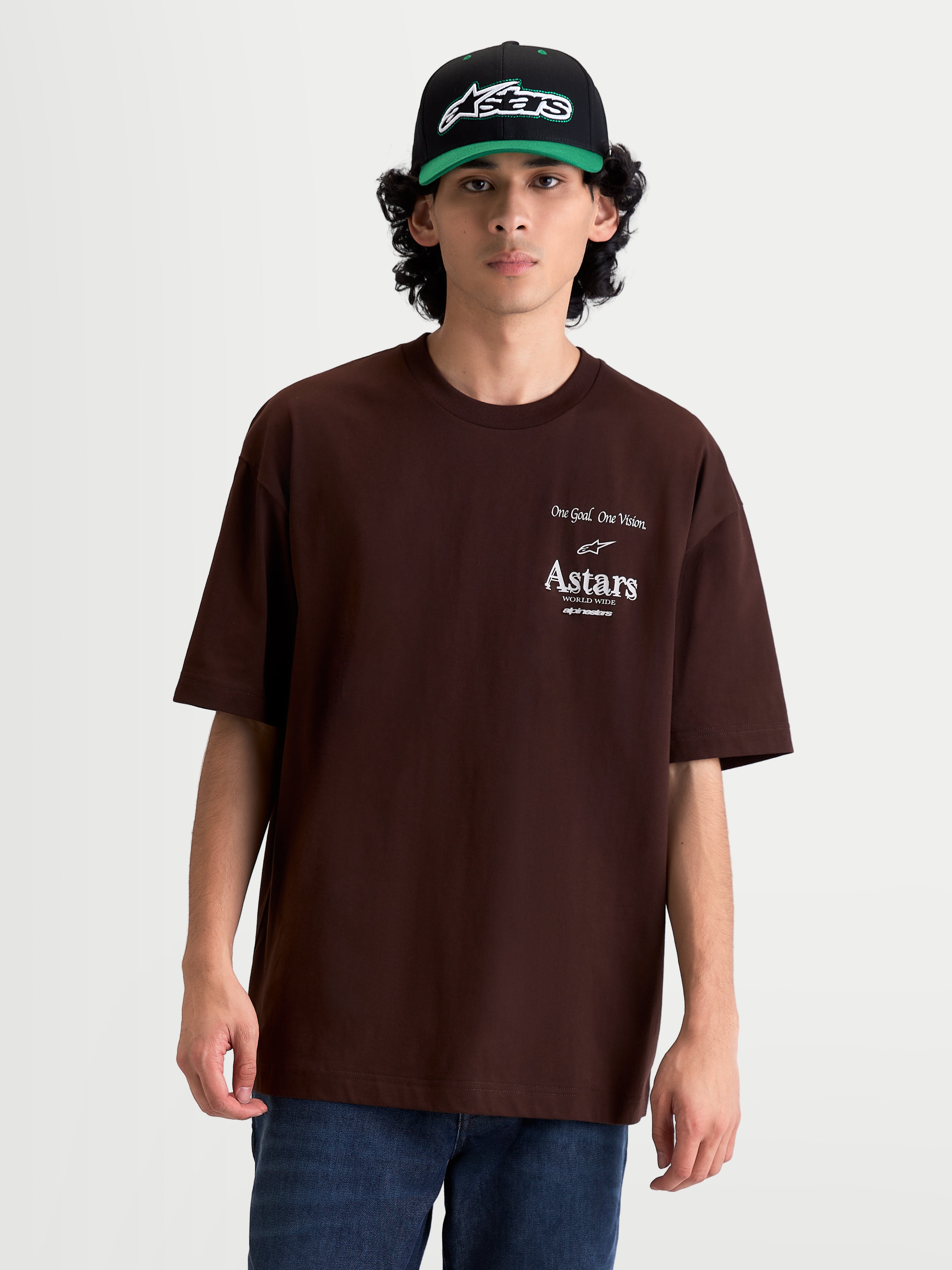 Alpinestars Camiseta Oversized Post CSF, camiseta de mangas cortas de hombre en color marrón, con gráficos del logotipo Astars y texto 'One Goal. One Vision.' en el pecho en color blanco, ajuste oversized de estilo casual