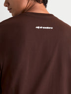 Alpinestars Prelude Oversized CSF, camiseta de mangas cortas marrón con logotipo Alpinestars blanco en la espalda, ajuste holgado, ropa deportiva