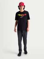Alpinestars Camiseta Elliptogrit CSF, camiseta de mangas cortas para hombre, negra con logotipo de la palabra Astars en degradado amarillo y rojo, confeccionada en mezcla de algodón y poliéster, ropa casual de estilo sportswear