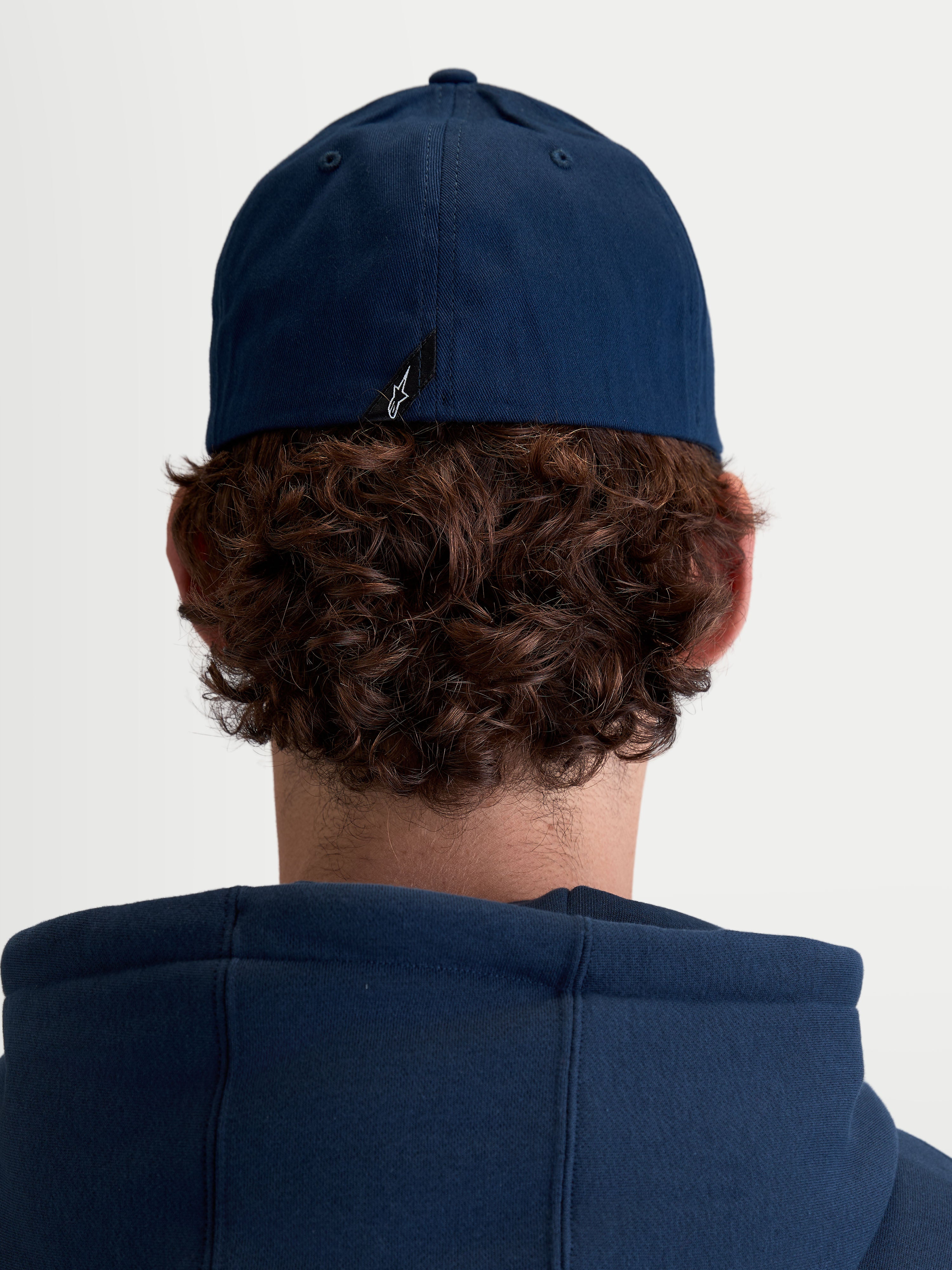 Alpinestars Arclight Hat, Unisex Sportswear Baseball Cap, Navy Blue, Durable Cotton Twill with Flex Back, Rear View on Model showing signature Astars logo label detail.