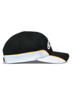Alpinestars gorra 500 Snapback, gorra de béisbol de estilo motorsport, negra y blanca con ribete naranja, perfil lateral con visera curva, corona estructurada y detalle de ribete en contraste, ropa deportiva