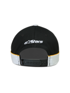 Alpinestars gorra 500 Snapback, gorra de estilo lifestyle deportivo, negra y blanca con detalles amarillos, cierre snapback ajustable, vista trasera con logotipo Astars bordado en blanco y detalles de confección con ribete en contraste