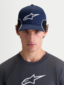 Alpinestars 500 Snapback Hat, Sportswear Baseball Cap for Men, Navy Blue and Black, featuring a curved bill and structured crown with a 3D embroidered Astars logo and white contrast piping, front view on model.