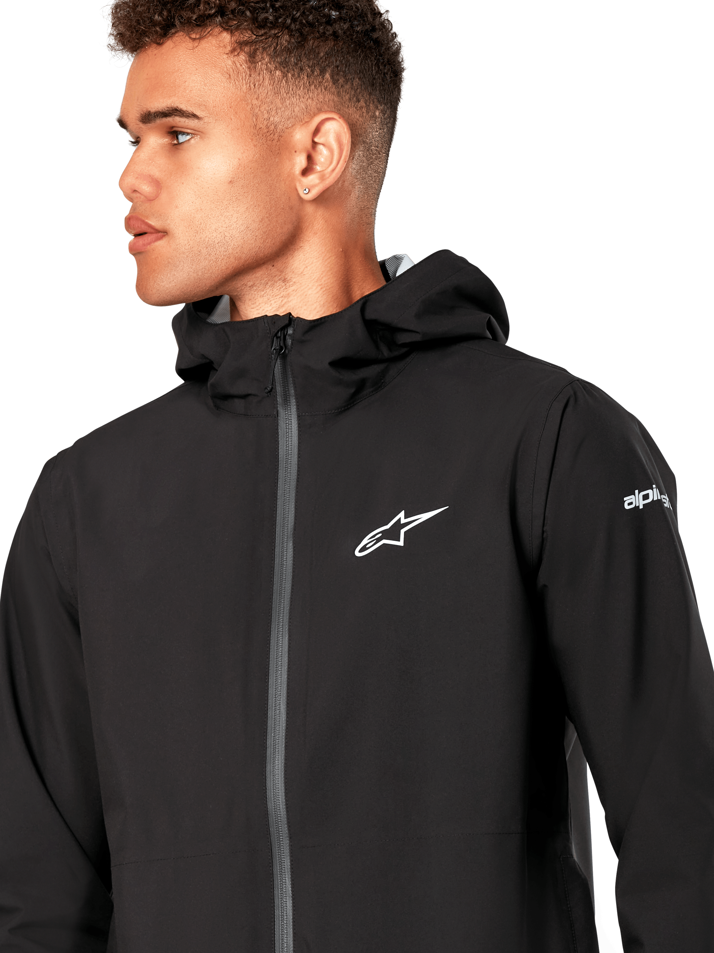 Alpinestars Kascade Rain Jacket, Black Rain Shell Jacket, featuring a white star logo on the chest, fixed hood, and coated reverse coil front zipper, casual motorsport-inspired performance outerwear