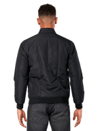 Alpinestars Precedent Jacket, Black, rear view on model, featuring iconic angled quilt pattern, rib cuffs and hem, quilted F1-inspired motorsport styling