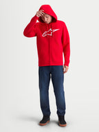 Alpinestars Sudadera con capucha Ageless Zip V3, roja y blanca, sudadera de forro polar para hombre con cremallera frontal completa, logotipo Astars en el pecho, capucha con cordones y puños acanalados, ropa deportiva para fans del motorsport, modelo llevándola puesta