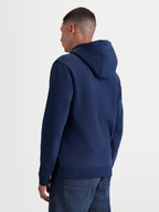 Alpinestars sudadera con capucha Ageless V3, ropa deportiva casual para hombre, azul marino, forro polar de algodón y poliéster reciclado, vista posterior en modelo con capucha forrada y detalles de canalé
