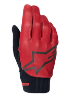 Guantes Alpinestars A-Dura, guantes de ciclismo MTB, naranja oscuro y negro, parte superior con patrón de cuadrícula texturizada, logotipo de estrella negra grande, puño de neopreno negro con marca en rojo, diseñados para el agarre y el rendimiento en bicicleta de montaña