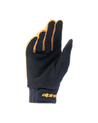 Guantes Alpinestars A-Dura, guantes para bicicleta de montaña, color oro oscuro y negro, vista de la palma que muestra el material de ante sintético, puño de neopreno con correa de gancho y bucle dorada, diseñados para el agarre y la movilidad en el ciclismo.