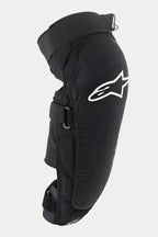 Protector de rodilla/espinilla Alpinestars Vector Pro, negro, con un logotipo de Alpinestars blanco en la rodilla, panel frontal texturizado resistente a la abrasión, correas ajustables de gancho y bucle, equipo de protección transpirable para MTB