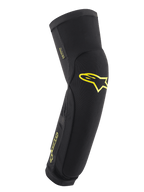 Alpinestars Paragon Plus Rodilleras/Espinilleras, negro con logotipos en Acid Yellow, manga protectora tipo slip-on para MTB, con malla transpirable y tejido rip-stop reforzado, ajuste ergonómico preformado para ciclismo