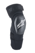 Alpinestars A-Impact Plasma Elite Shield Knee Protectors, negros con logotipo de estrella blanca, carcasa exterior de TPU rígido, tejido de malla con correa superior ajustable, diseño ergonómico precurvado, protección para MTB y todoterreno