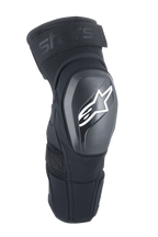 Alpinestars A-Impact Plasma Elite Shield Knee Protectors, negros con logotipo de estrella blanca, carcasa exterior de TPU rígido, tejido de malla con correa superior ajustable, diseño ergonómico precurvado, protección para MTB y todoterreno