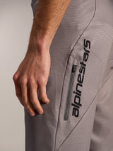 Gray A-Dura Elite Flex Shorts featuring a vertical black Alpinestars logo and zippered pocket on ripstop fabric.