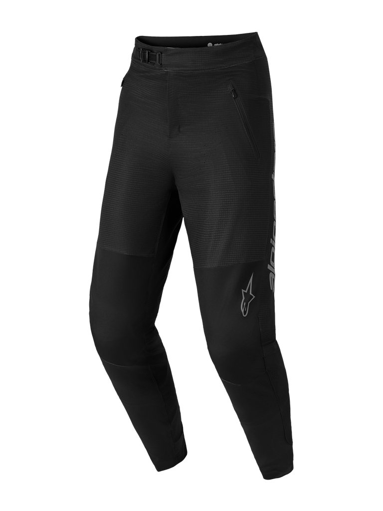 Pantalones MTB A-Dura Elite Flex negros con tejido elástico, cierre de trinquete y logotipos Alpinestars grises.