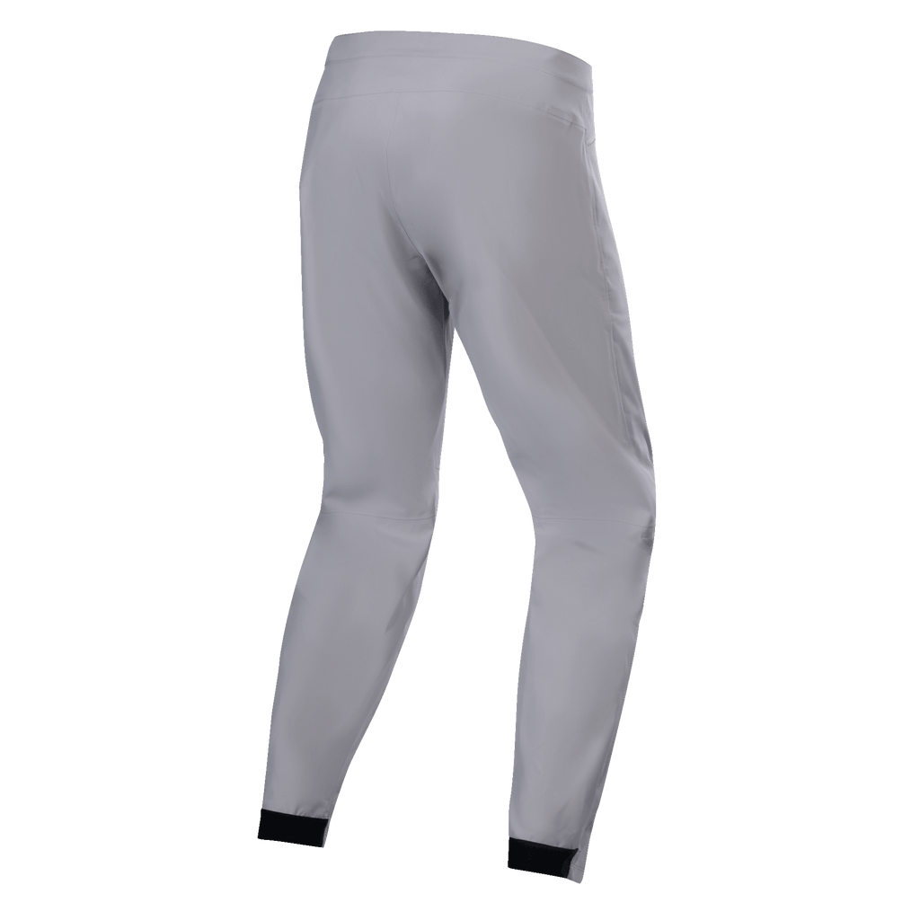 Pantalones impermeables Alpinestars A-Dura, pantalones de MTB, gris titanio, vista trasera, con perneras cónicas y puños elásticos negros, diseño técnico minimalista para ciclismo de montaña