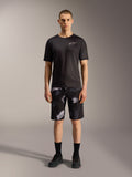 Pantalones cortos Alpinestars A-Dura Ride en Black Camo con camiseta técnica negra, versatilidad para ciclismo de montaña.